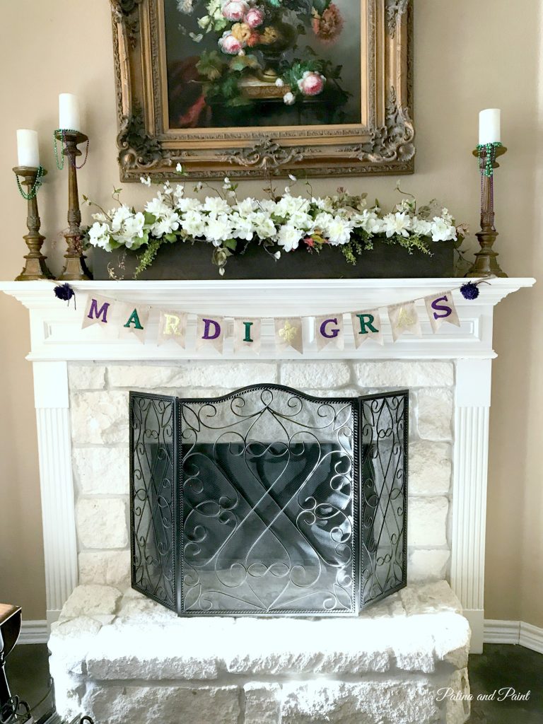 fireplace with Mardi Gras banner