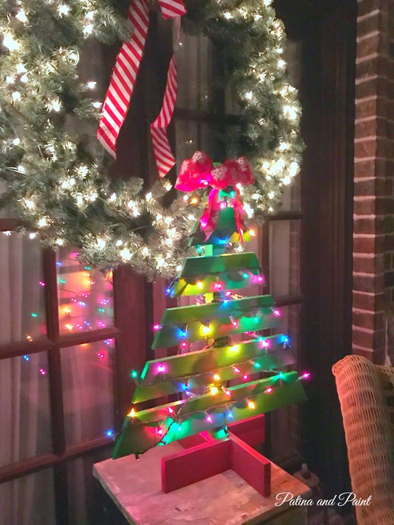 Wooden Christmas tree on porch