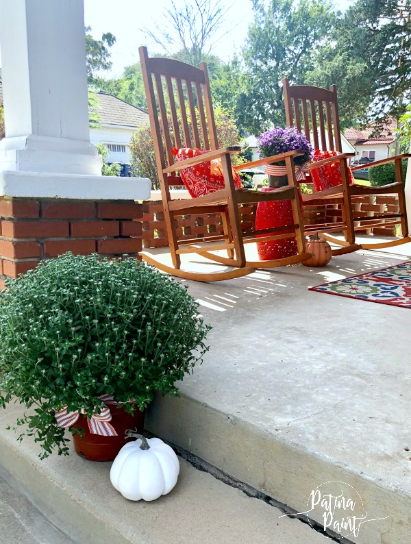 rocking chairs, porch, mums and pumpkins